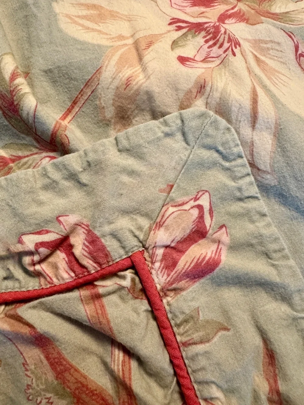 Floral Pastel Duvet Cover on a Light Moss Background with Pink-Coral Piping